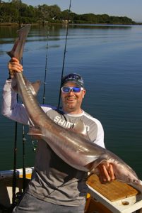 Chris Stamalos with the larger of the two gummy sharks he caught offshore from Barwon Heads on Saturday.