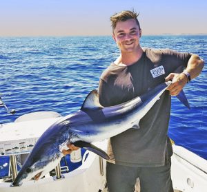 Judson Belousoff with the mako shark he caught offshore from Port Phillip Heads.