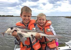 Henry and Sophia Jankowski with the elephant fish they caught from the Barwon estuary on Sunday (Picture: Warren Jankowski).