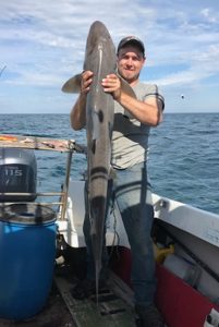 Darcy Scott with his 20 kg gummy shark taken offshore from Barwon Heads on Sunday morning (Picture: Murray Scott).