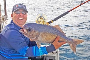 Michael Goldby with one of the blue eye trevally he caught offshore from Portland over the weekend (Picture: Bob McPherson).