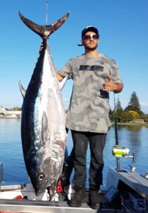 Ben Zebic with the 107 kg bluefin tuna he caught off Portland from his small alloy boat over the weekend (Picture: Bob McPherson).