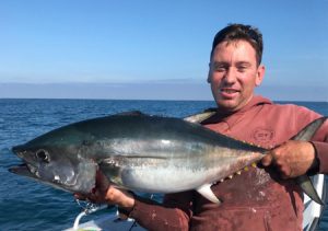 Justin Burns with one of the tuna he and Phil Nelson caught off Cape Nelson near Portland over the weekend (Picture: Phil Nelson).