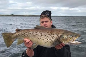 Declan Betts with the 6.22 kg brown trout that he caught from Lake Purrumbete on Friday (Picture: Courtesy of Victorian Fisheries Authority).