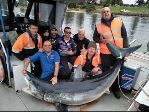 Grazio Dalli ( bottom left), his companions, and the crew of Reel Time Fishing Charters (Picture: Chris Hawli).