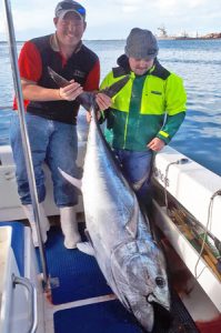 Matt Harris and Bailey Metch with another tuna of 101.5 kg aboard Red Hot Charters (Picture: Bob McPherson).